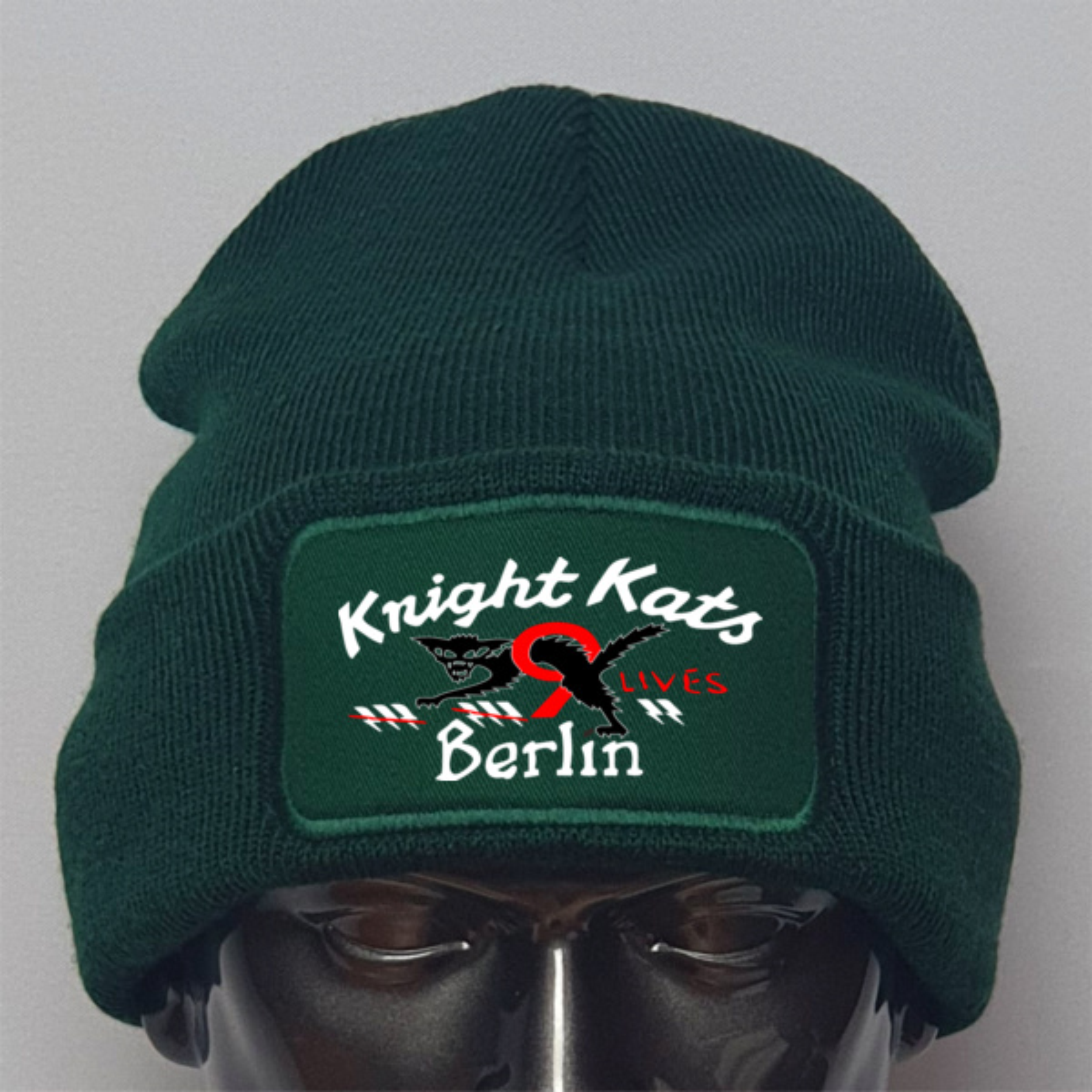 Green beanie with 'Knight Kats' logo on a gray background