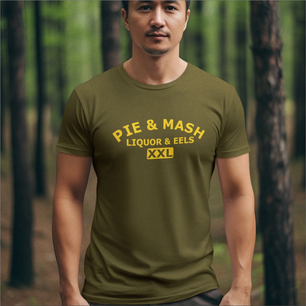 Man wearing a green t-shirt with yellow text in a forest setting
