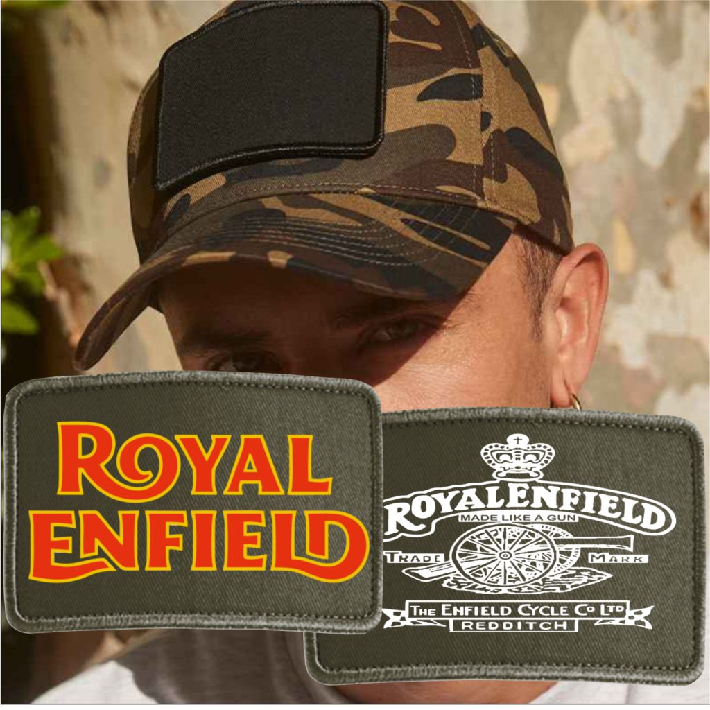 Person wearing a camouflage cap with Royal Enfield patches displayed.