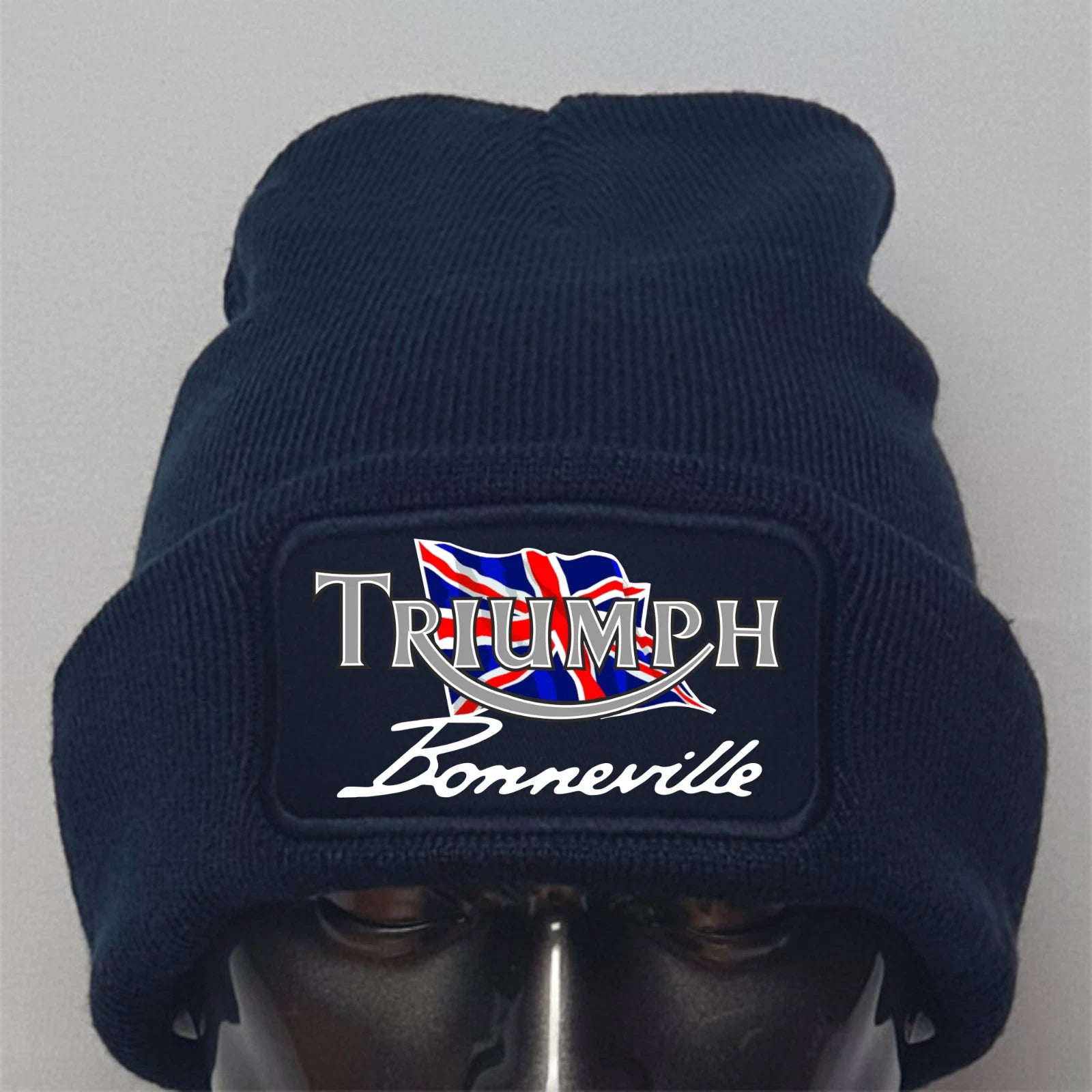 Navy blue beanie with Triumph Bonneville logo on a gray background