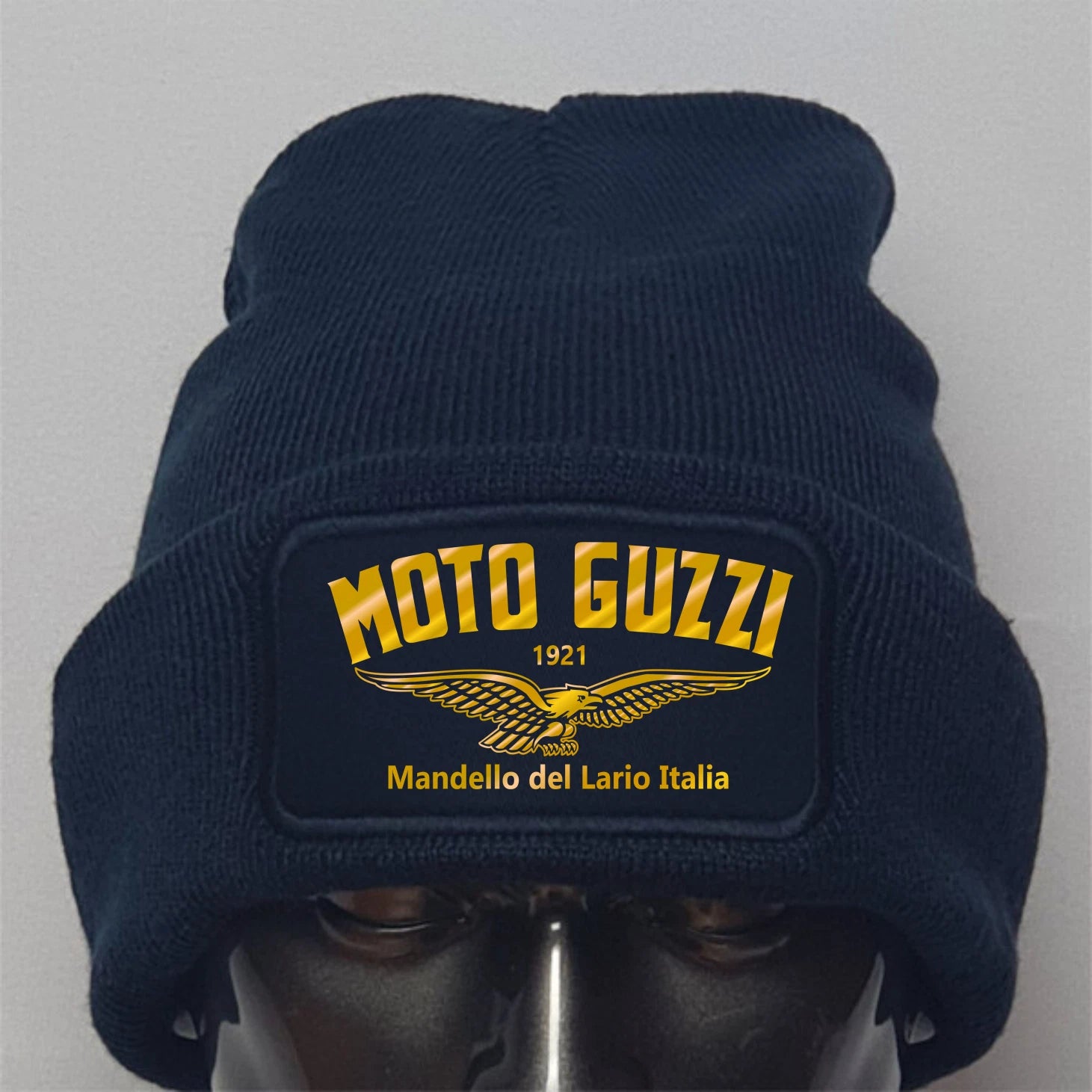 Navy blue beanie with Moto Guzzi logo on a gray background