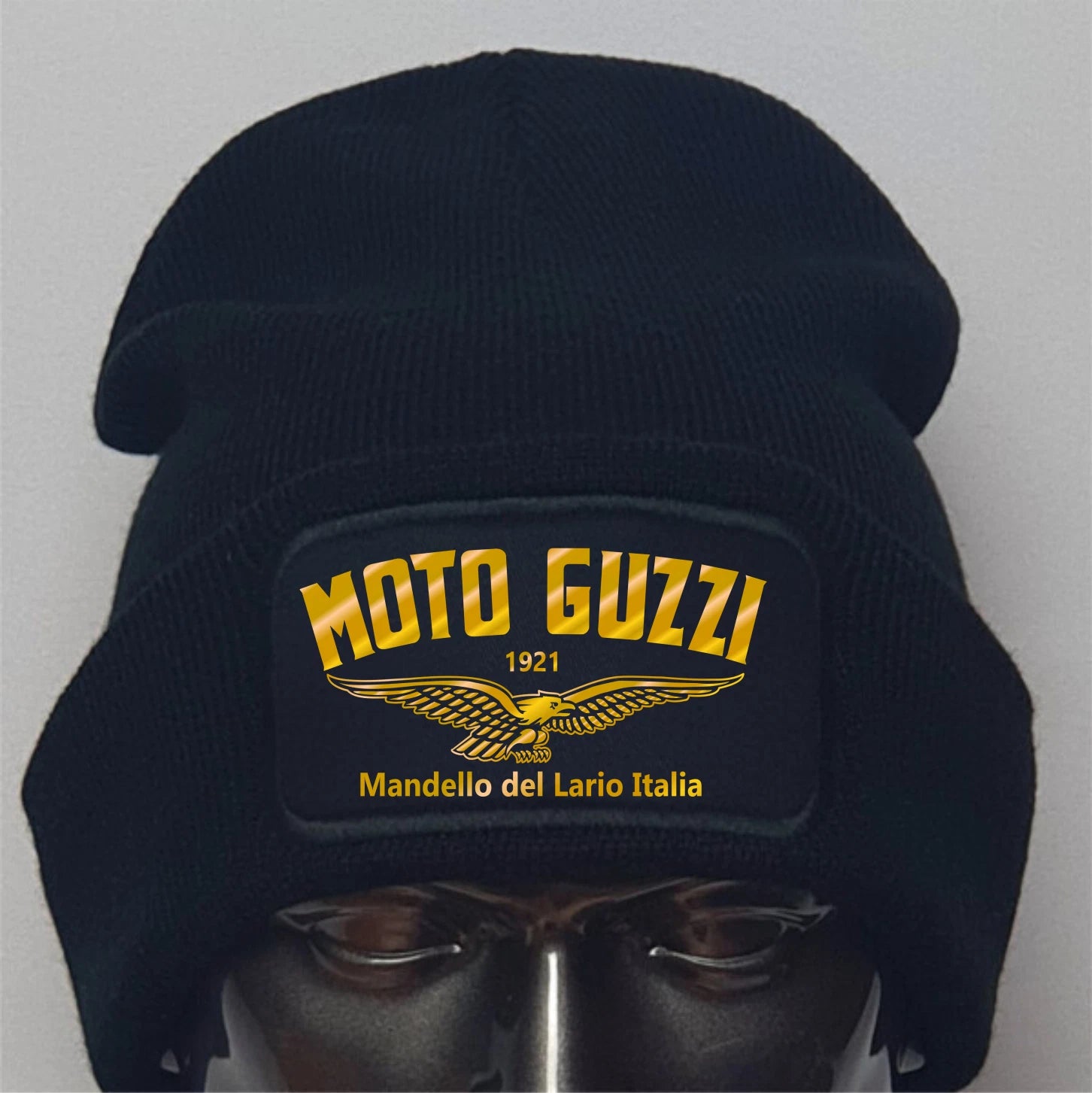 Black beanie with Moto Guzzi logo on a gray background