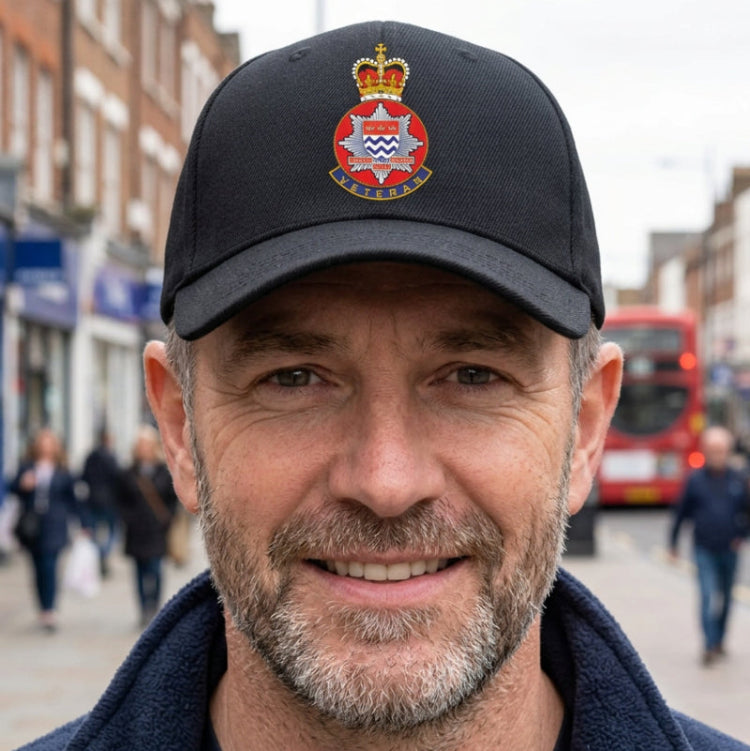 Man wearing a London Fire Brigade Veteran Baseball Cap.