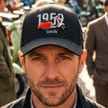 A black baseball cap featuring a graphic of a red and white 1959 Vespa Tambretta scooter in front of large white '1959' text.