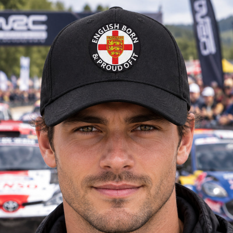 A black baseball cap featuring a circular embroidered graphic on the front. The graphic includes a red St.