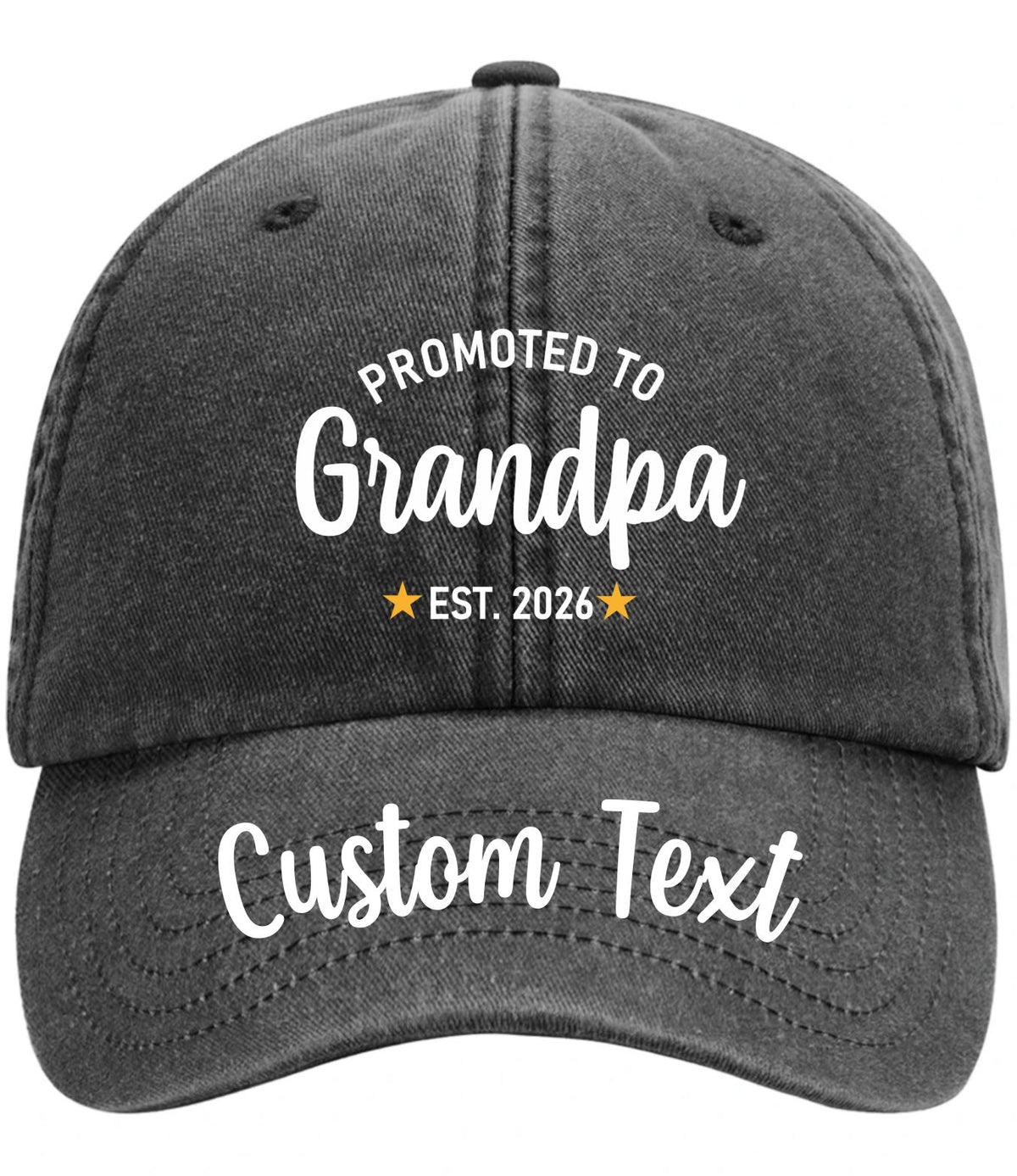 A blackwashed baseball cap with white printed text reading 'PROMOTED TO Grandpa' and 'EST. 2026' with small gold stars, plus 'Custom Text' on the brim, shown on a plain white background.