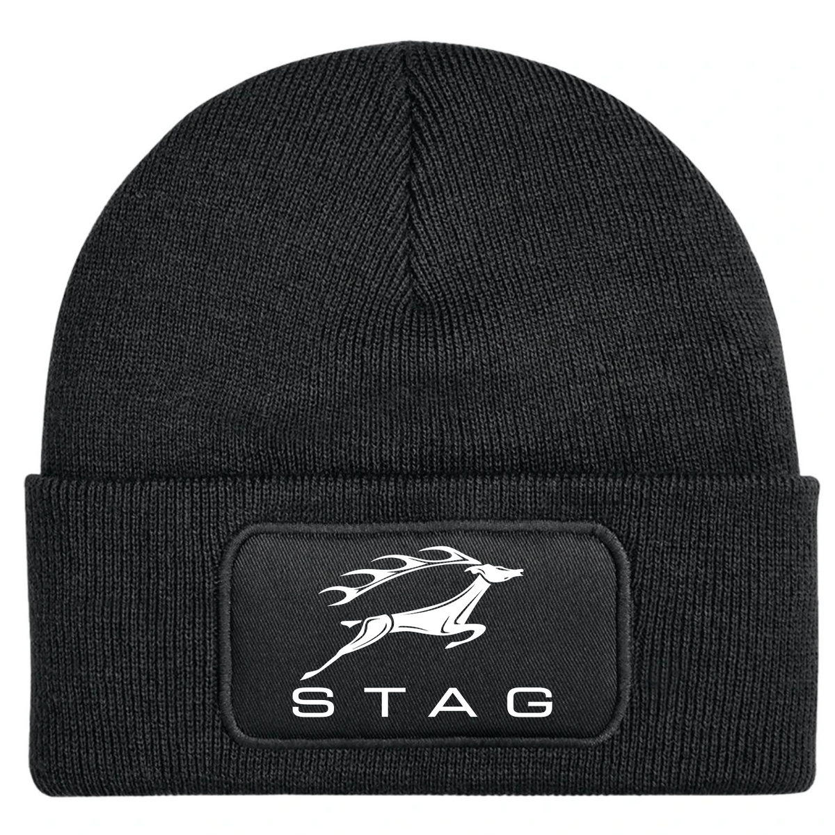 A black ribbed knit beanie hat featuring a rectangular black patch on the front cuff with a white printed stag logo and the word 'STAG'.