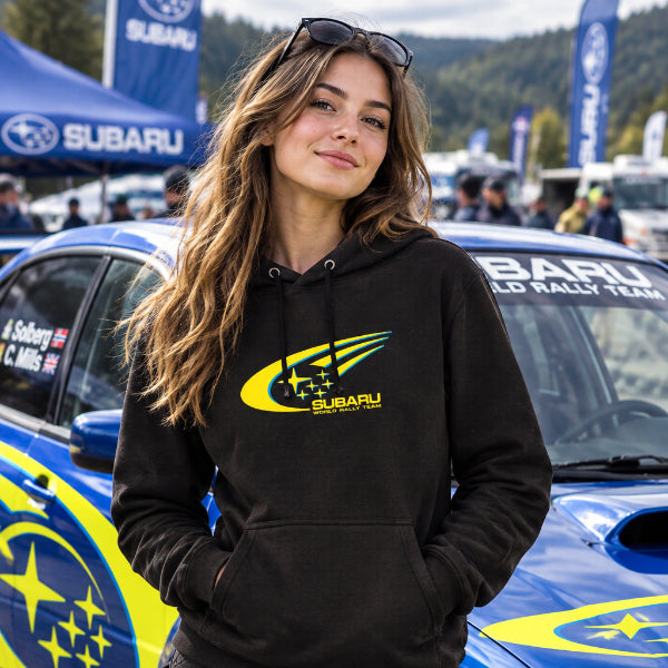 A black pullover hoodie featuring a yellow and green Subaru logo printed on the center chest, displayed against a solid white background.