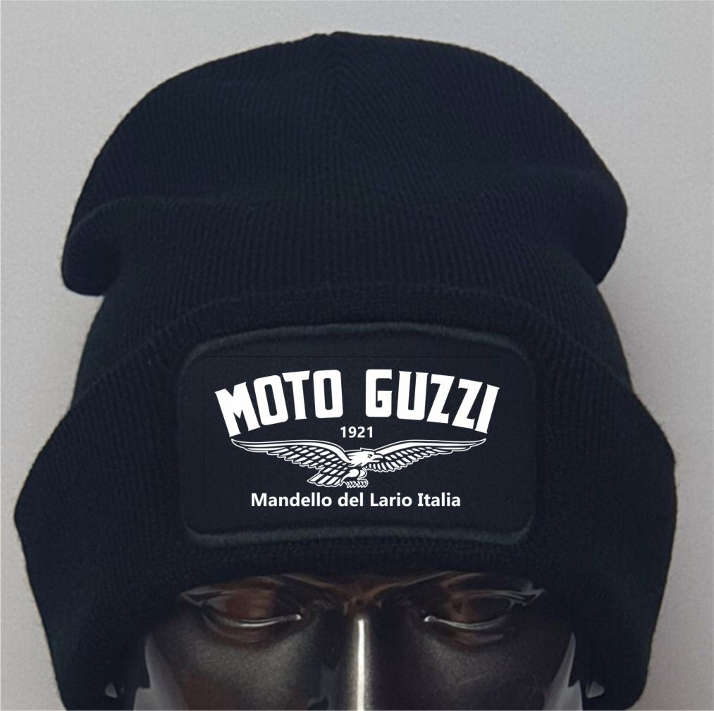 Black beanie with Moto Guzzi logo on a mannequin head against a gray background