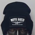 Black beanie with Moto Guzzi logo on a mannequin head against a gray background