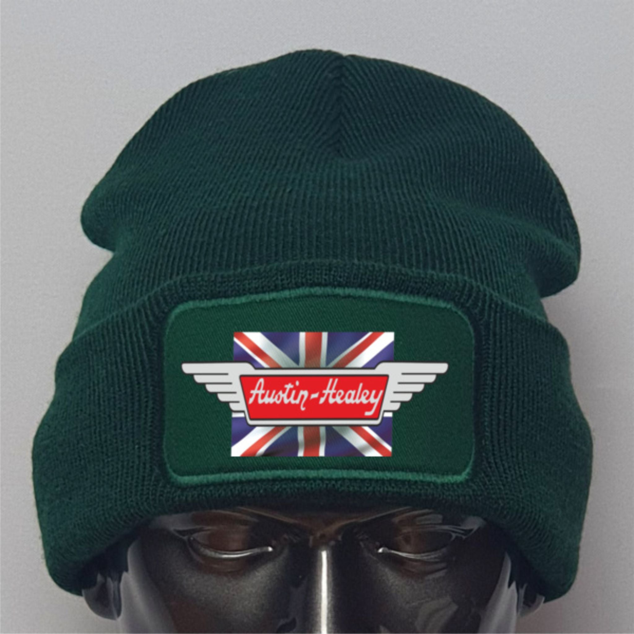 Green beanie with Austin-Healey logo on a gray background
