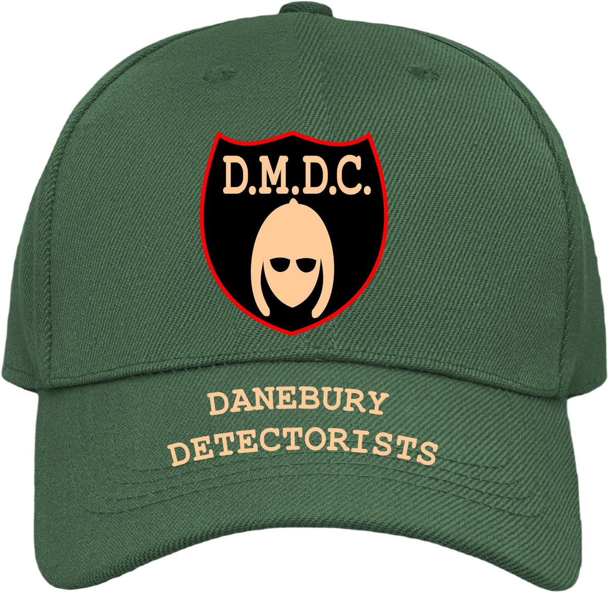A dark green baseball cap featuring a front shield patch with the text 'D.M.D.C.' referring to the BBC comedy series The Detectorsts.