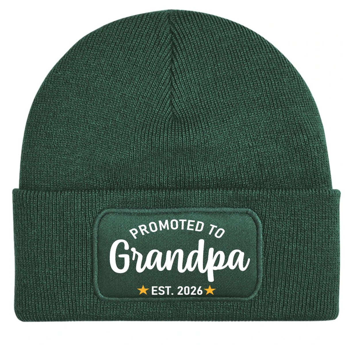 A dark green ribbed knit beanie hat with a cuffed brim, featuring a rectangular embroidered patch on the front that reads 'PROMOTED TO Grandpa EST. 2026' in white and yellow.