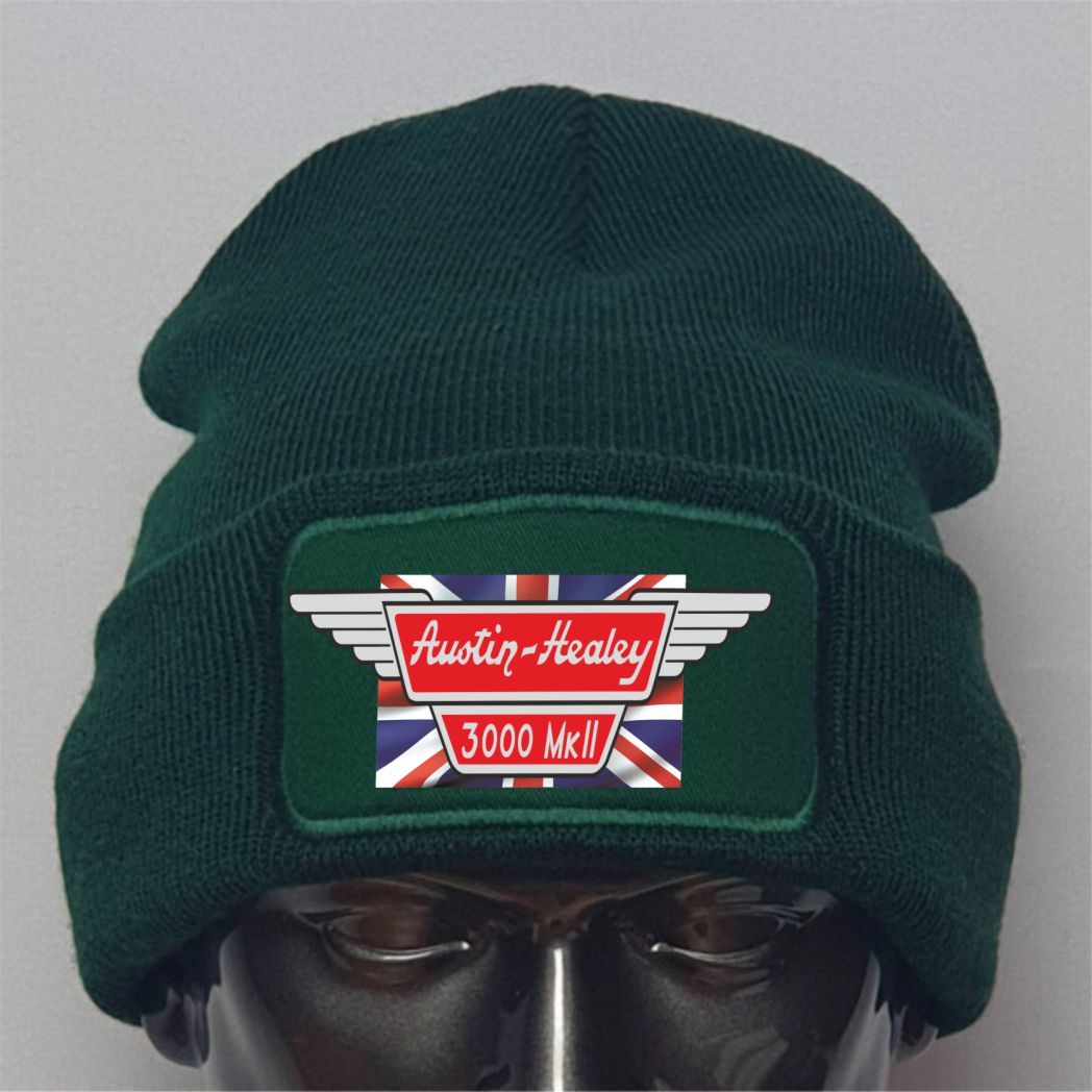 Green beanie with Austin-Healey logo on a gray background