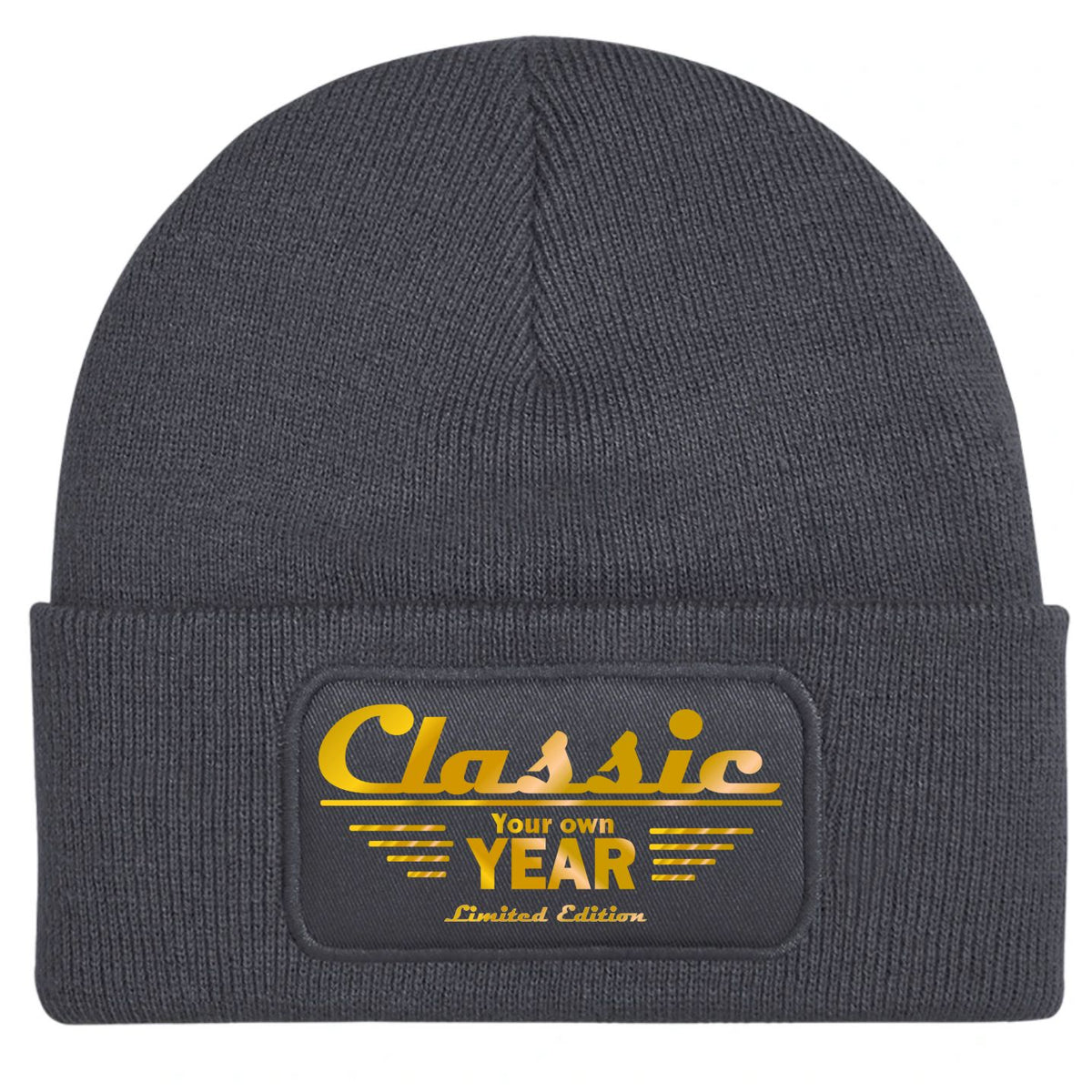A customizable charcoal gray ribbed knit beanie hat featuring a rectangular embroidered patch on the front cuff with the text 'Classic Your own YEAR Limited Edition' in gold.