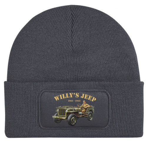 A dark gray ribbed knit beanie with a folded cuff, featuring a rectangular patch on the front that reads 'WILLY'S JEEP 1941-1942' above an illustration of a vintage military jeep.
