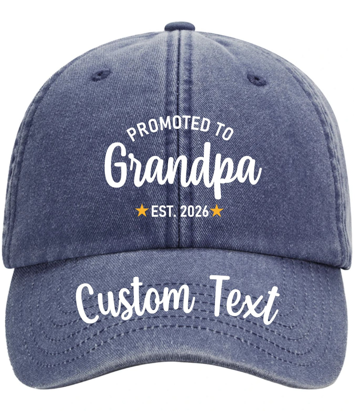A denim blue vintagebaseball cap with white embroidered text reading 'PROMOTED TO Grandpa EST. 2026' on the front and 'Custom Text' on the brim, shown on a plain white background.