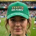 A green baseball cap featuring 'IRELAND SIX NATIONS RUGBY' and 'Women's Rugby 2026' text with rugby flags across the front, shown on a plain white background.