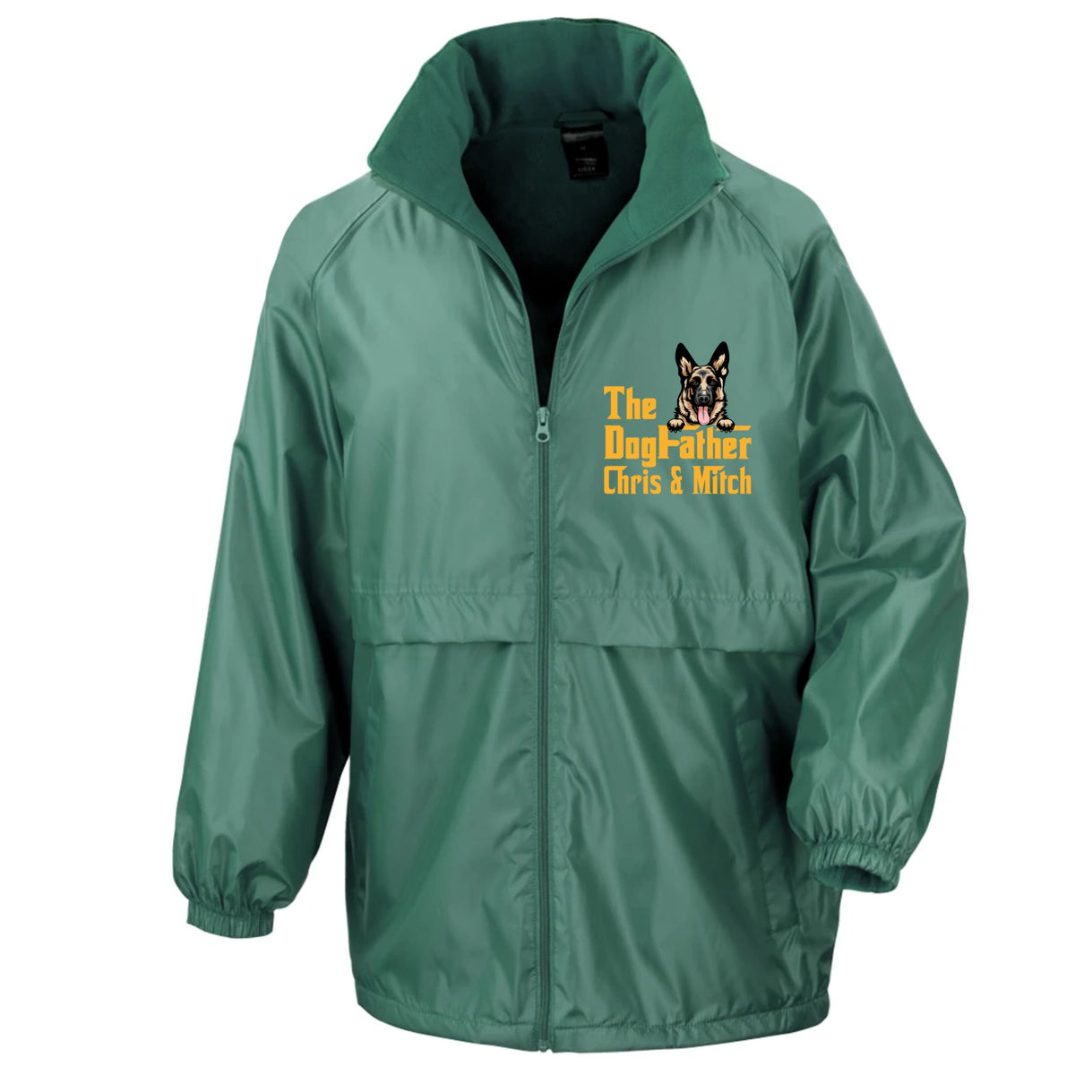 A green zip-up windbreaker jacket with a high collar, featuring a yellow and black dog graphic and the text 'The Dog-Father Chris & Mitch' on the left chest, displayed on a solid white background.