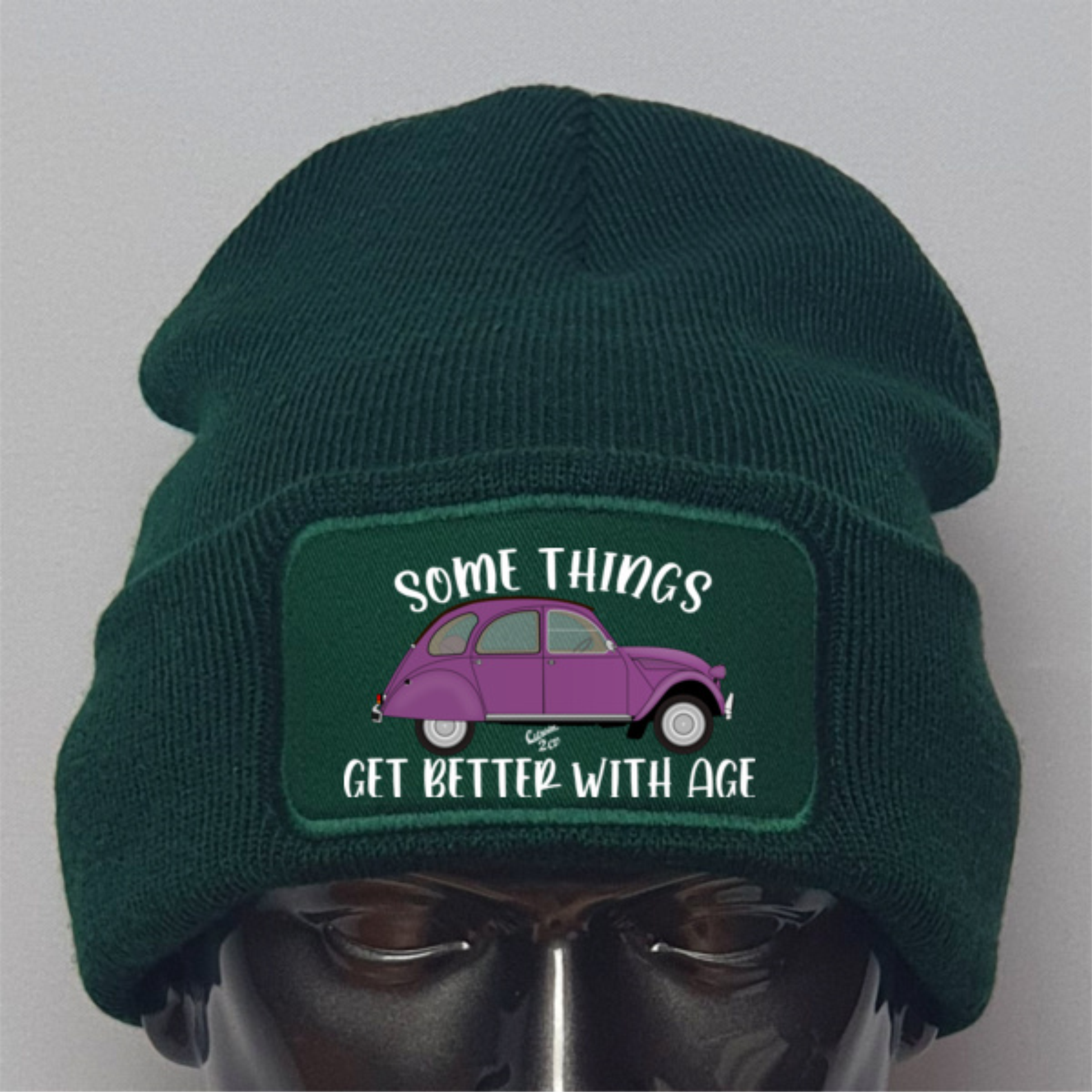 Green beanie with a purple car graphic and text on a gray background