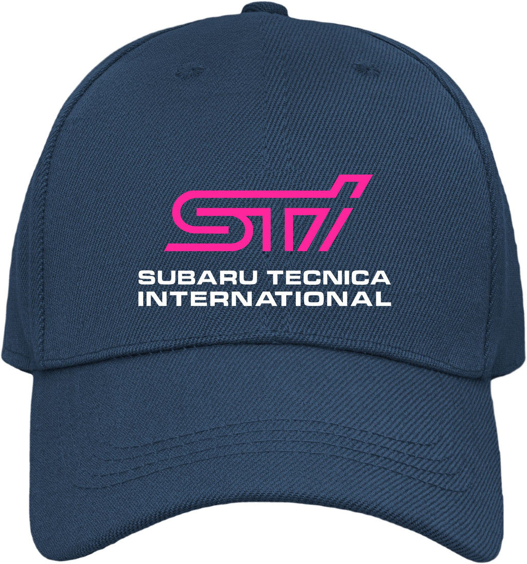 A navy blue baseball cap featuring a pink and white printed logo on the front that reads 'STI' and 'SUBARU TECNICA INTERNATIONAL'.
