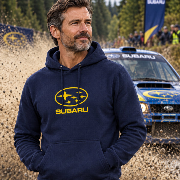 A navy blue pullover hoodie featuring the yellow Subaru logo and wordmark printed on the chest, displayed against a solid white background.