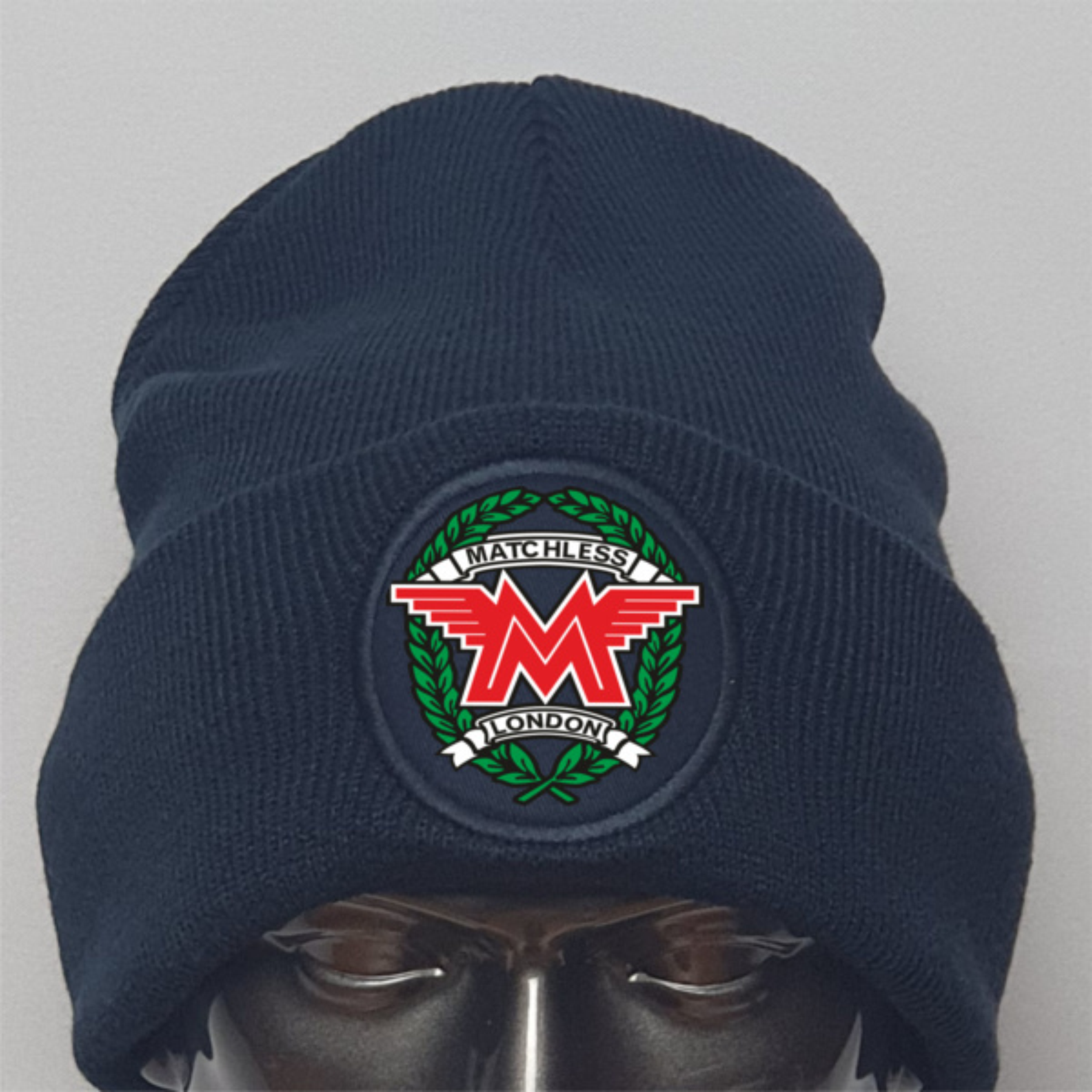 Navy blue beanie with Matchless logo on a gray background