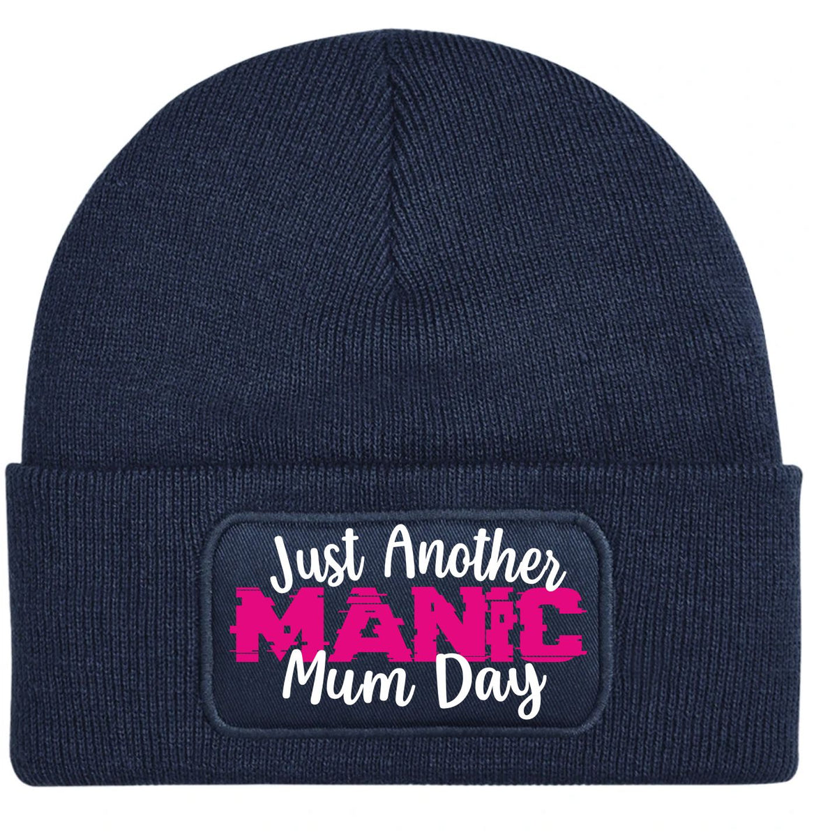 A navy blue ribbed knit beanie with a folded cuff, featuring a rectangular printed patch that reads 'Just Another MANIC Mum Day' in white and bright pink lettering.