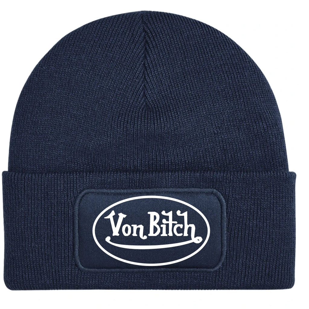 A navy blue ribbed knit beanie hat featuring a black rectangular patch on the front cuff with the white text logo 'Von Bitch'.