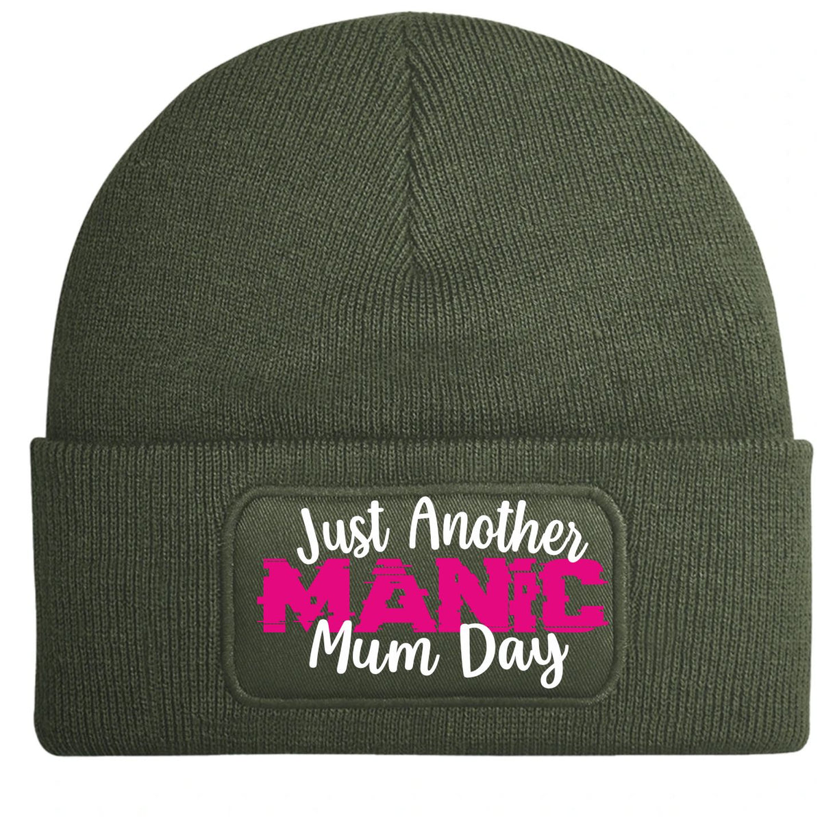 An olive green ribbed knit beanie with a cuffed brim, featuring a rectangular printed patch that reads 'Just Another MANIC Mum Day' in white and bright pink lettering.