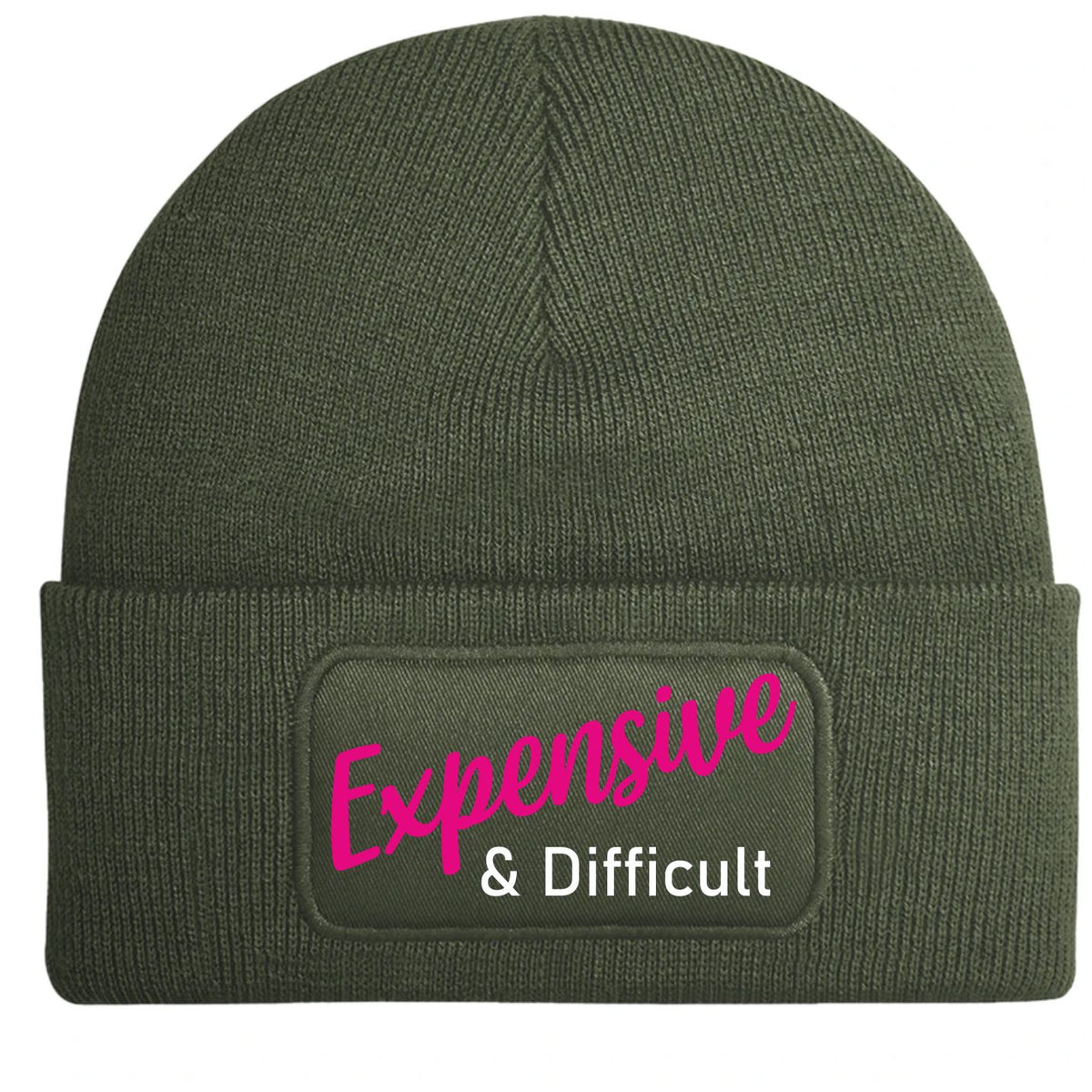 An olive green ribbed knit beanie hat with a folded cuff, featuring a rectangular patch on the front with the text 'Expensive & Difficult' in pink and white.