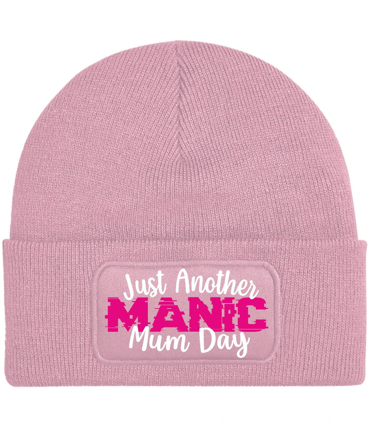 A light pink ribbed knit beanie hat featuring a cuffed brim with a rectangular patch that reads 'Just Another MANIC Mum Day' in white and bright pink lettering.