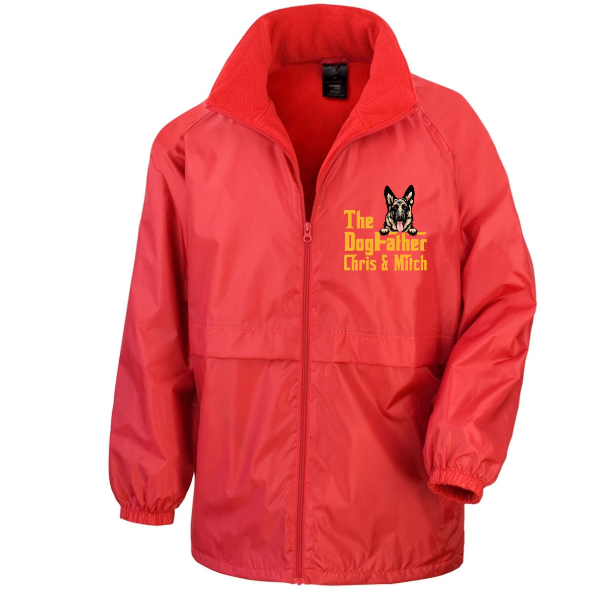A red zip-up windbreaker jacket with a stand-up collar, featuring a yellow and black embroidered graphic on the left chest that reads 'The Dog-father Chris & Mitch' with a dog illustration. The jacket is displayed on a clean white background.