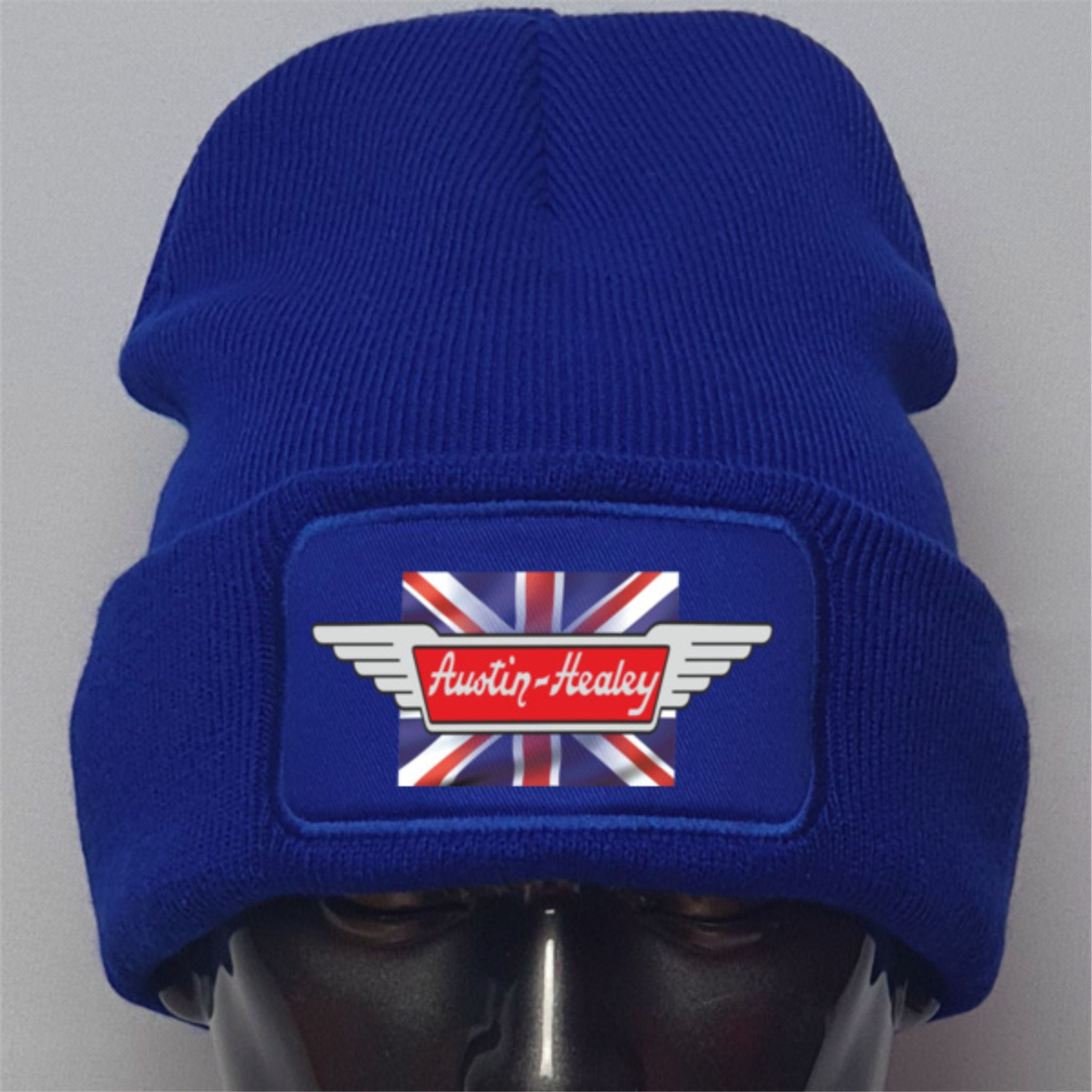 Blue beanie with Austin-Healey logo on a gray background