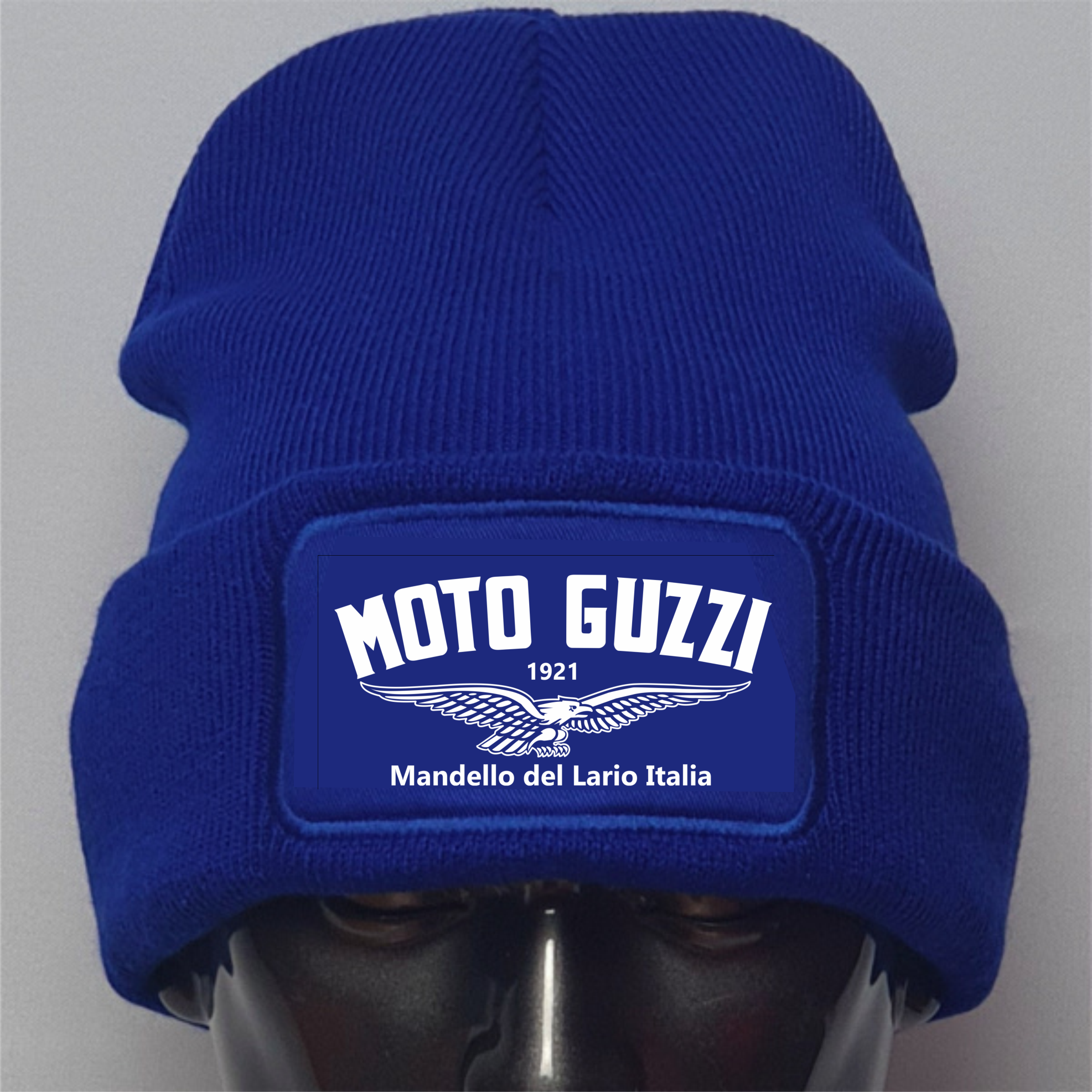 Blue beanie with Moto Guzzi logo on a gray background
