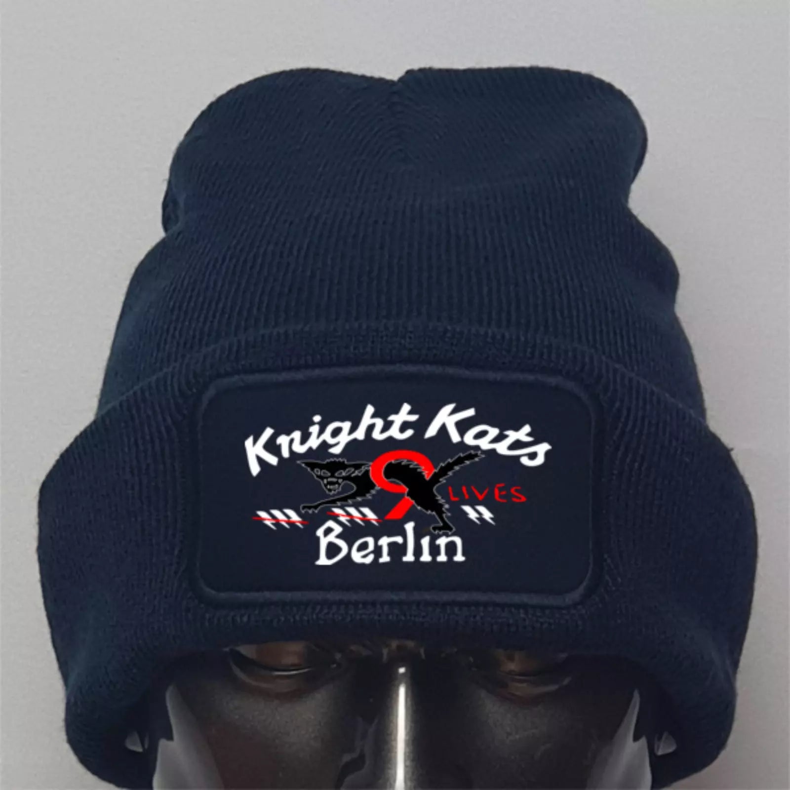 Navy blue beanie with 'Knight Kats' logo on a gray background