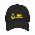 Black cap with HM Coastguard logo on a white background