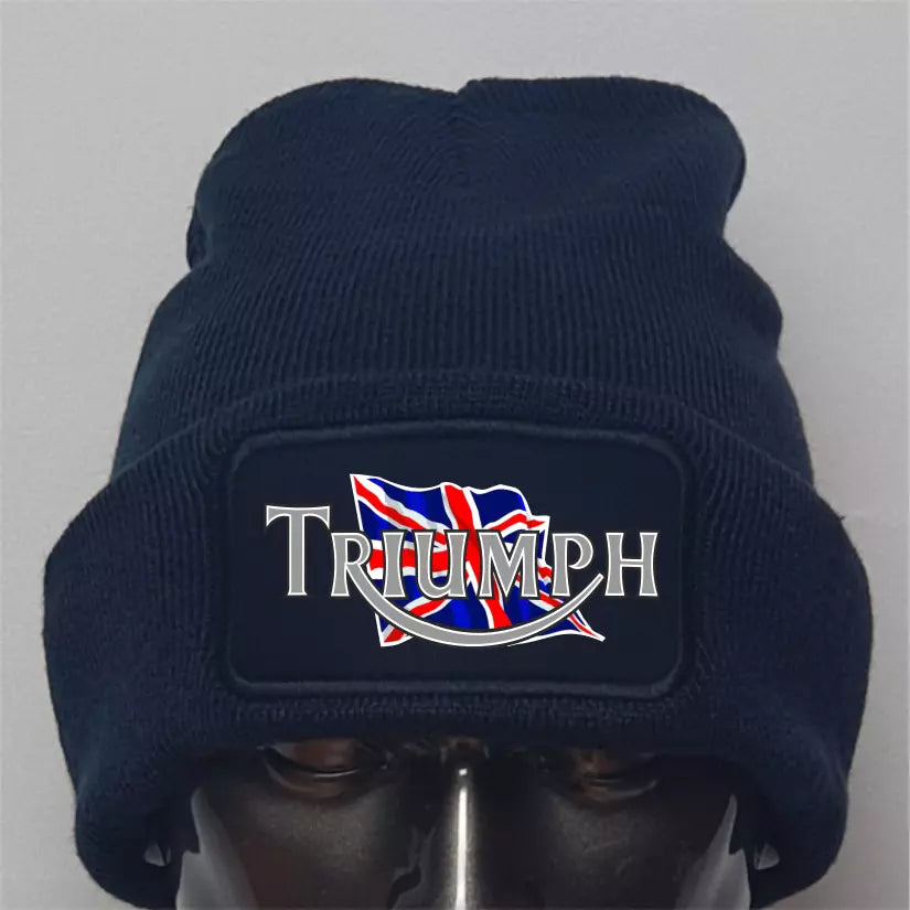 Navy blue beanie with Triumph logo featuring British flag design on a gray background