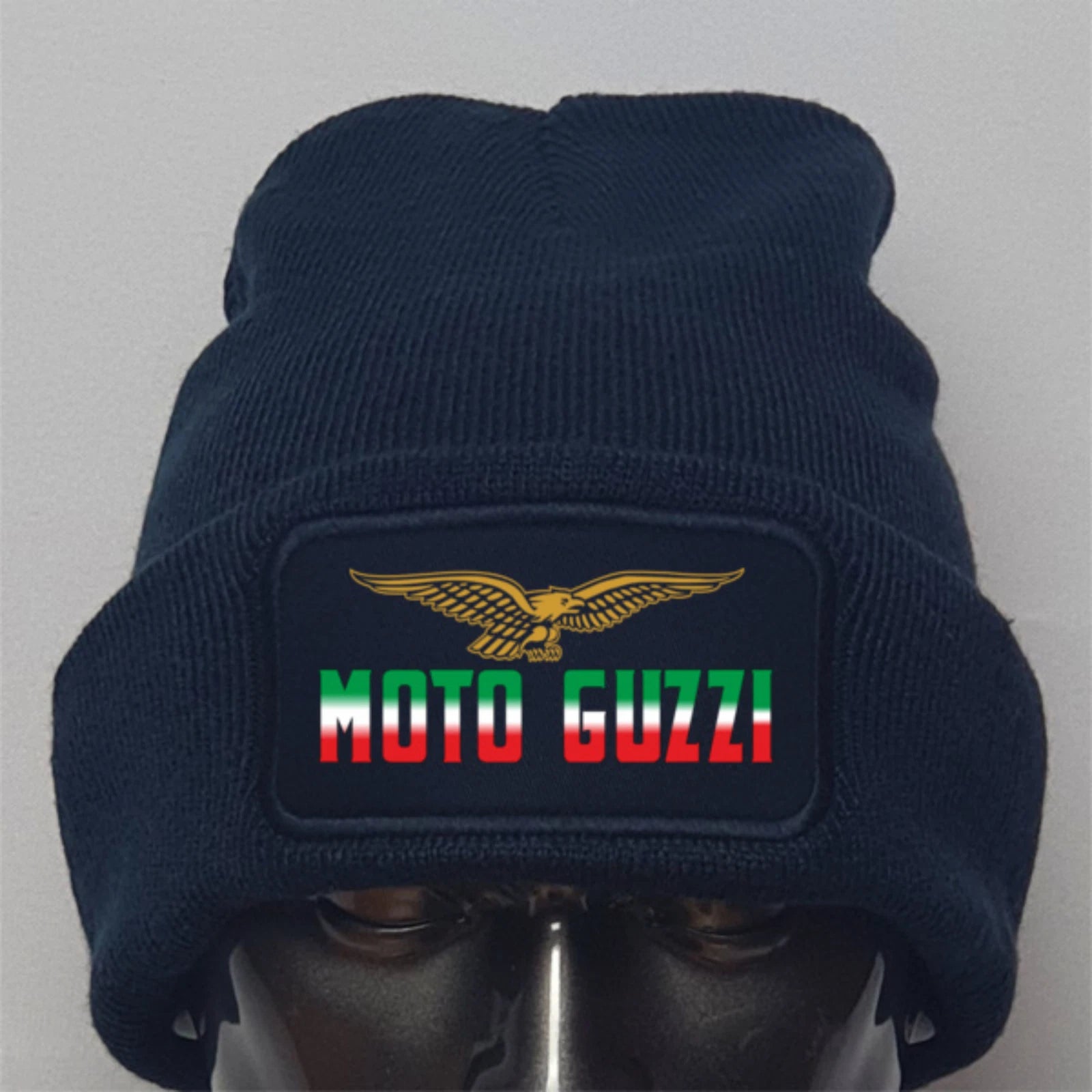Navy blue beanie with Moto Guzzi logo on a gray background