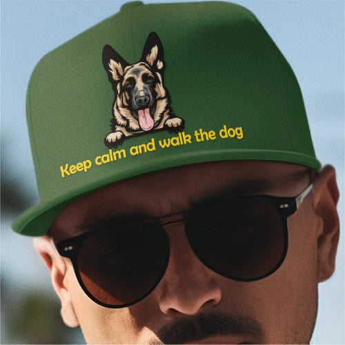 Green cap with a dog illustration and text 'Keep calm and walk the dog' worn by a person.