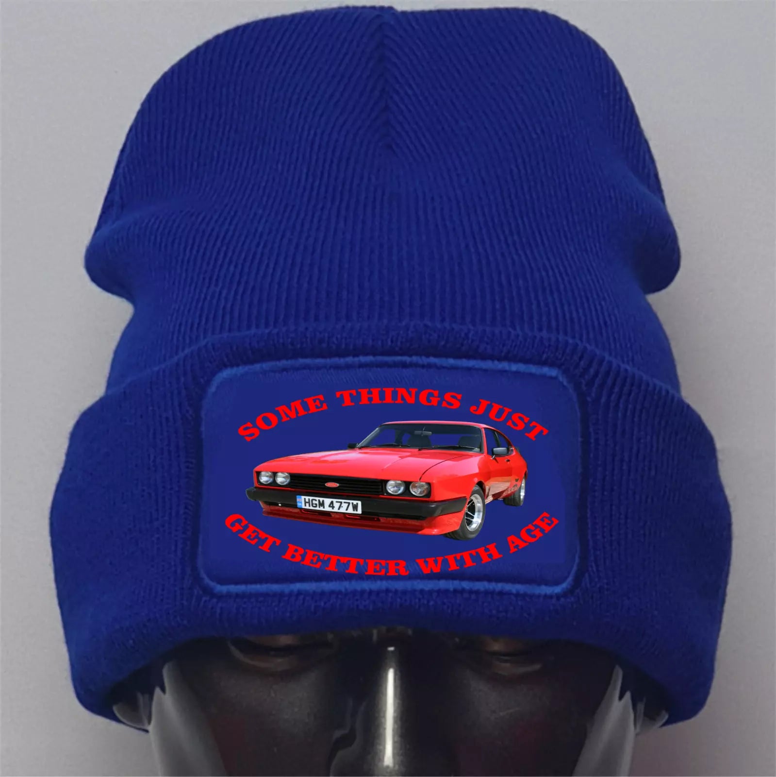 Blue beanie with a red car graphic and text on a gray background