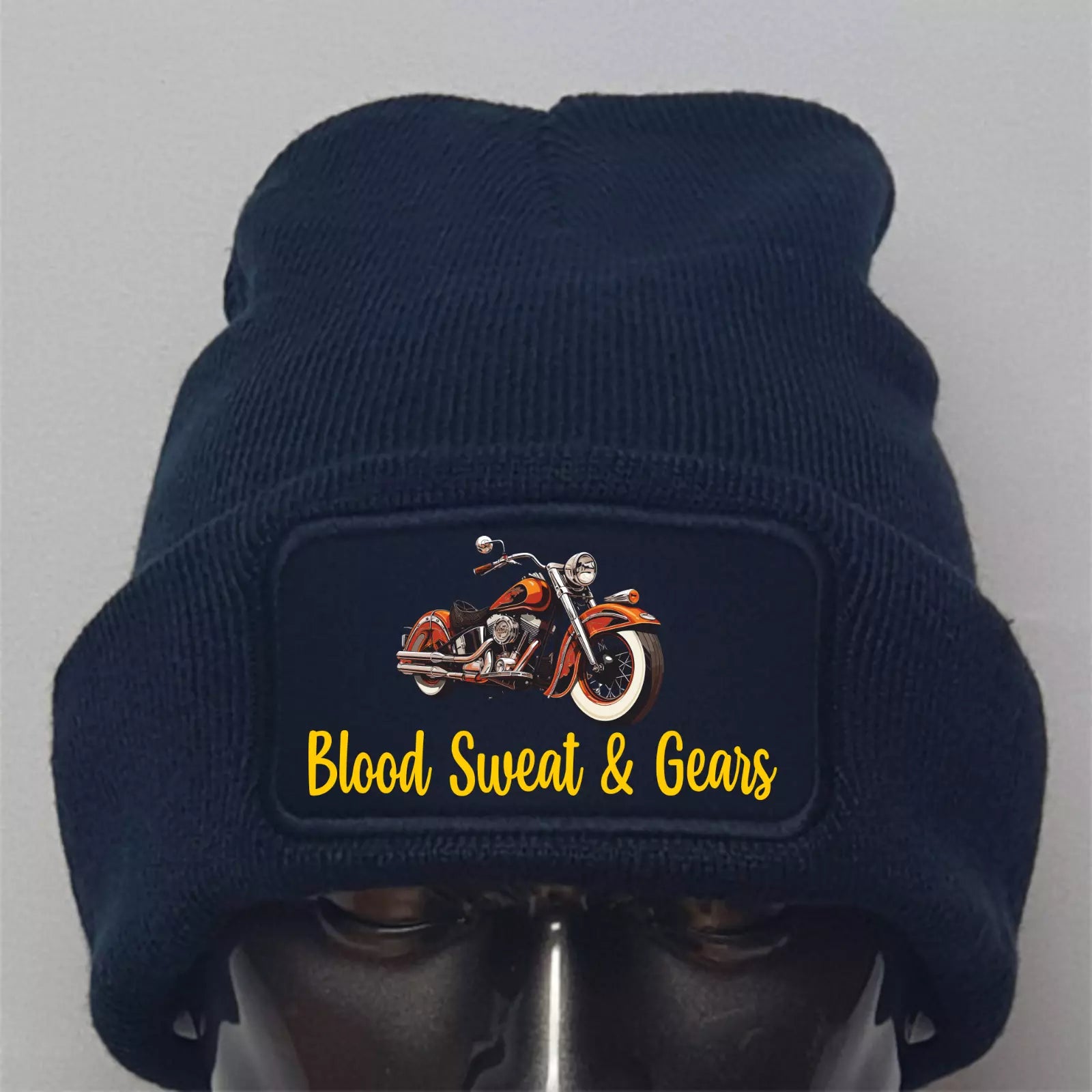 Navy blue beanie with a motorcycle graphic and 'Blood Sweat & Gears' text on a gray background