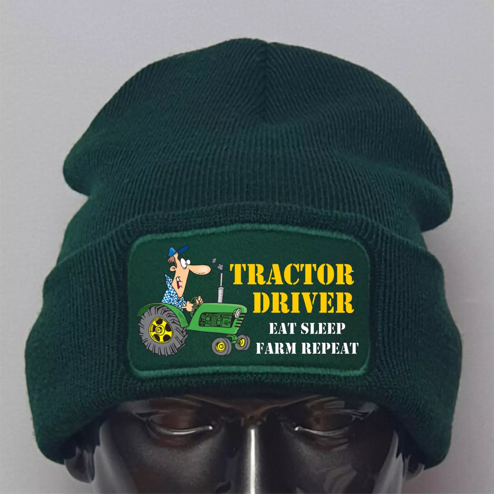 Green beanie with 'Tractor Driver' patch featuring a cartoon character on a gray background