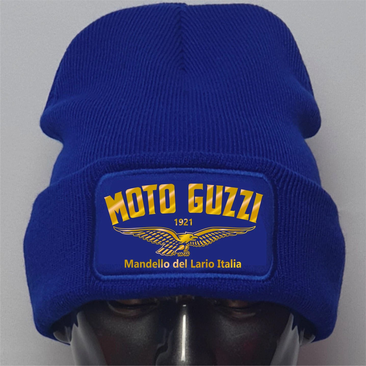 Blue beanie with Moto Guzzi logo on a gray background