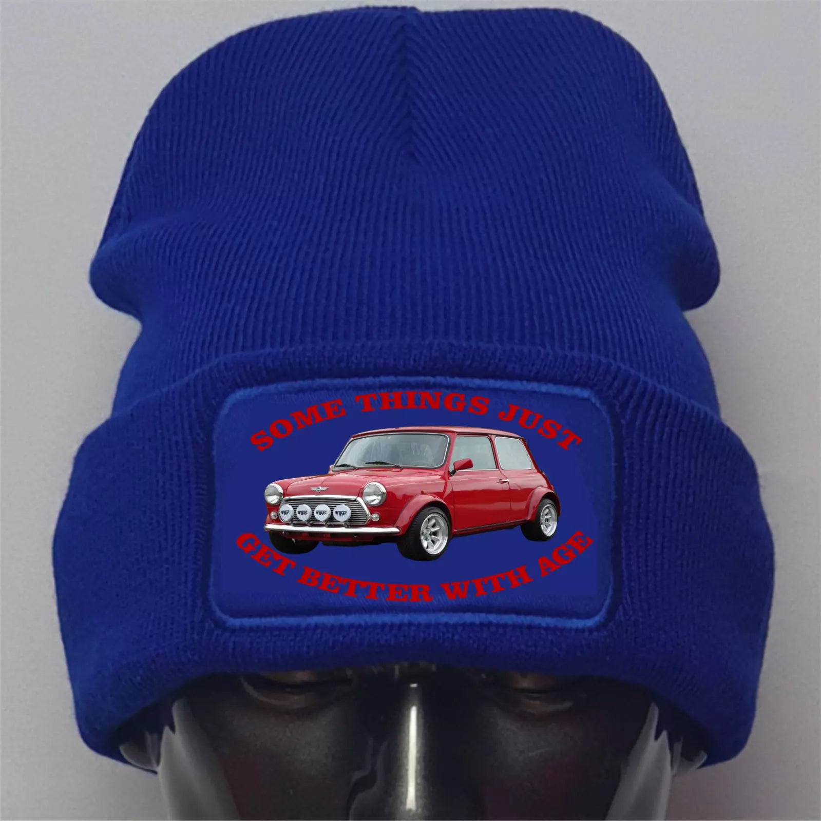 Blue beanie with a red car graphic and text on a gray background