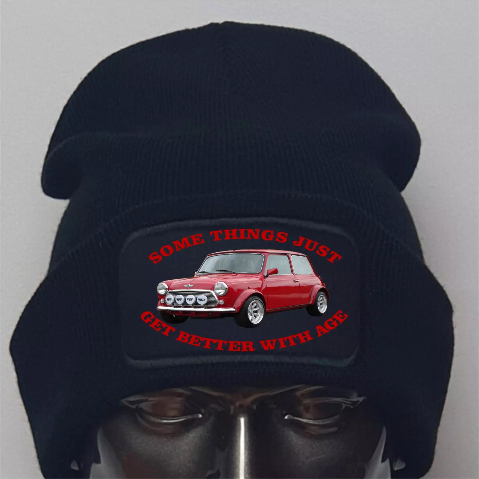 Black beanie with a red car graphic and text on a gray background