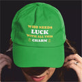 Green cap with text 'WHO NEEDS LUCK WITH ALL THIS CHARM' on a dark background