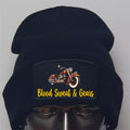 Black beanie with a motorcycle design and 'Blood Sweat & Gears' text on a gray background