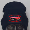 Black beanie with red car graphic and text on a gray background