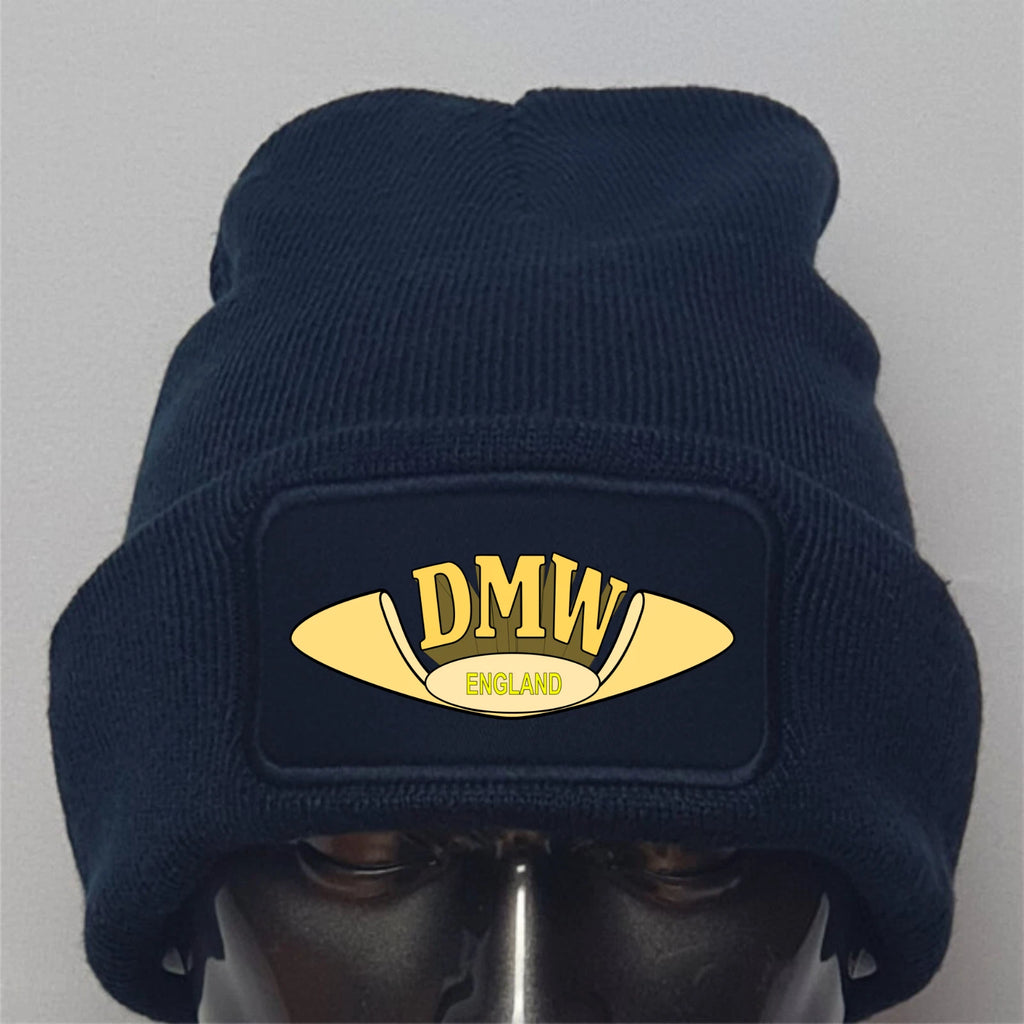 Navy blue beanie with gold 'DMW England' logo on a gray background
